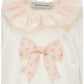 Set tutina e cuffia con fiocchi e balze