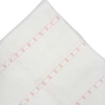 Copertina con trecce ricamate in rosa