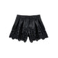 Shorts in ecopelle con ricamo floreale traforato